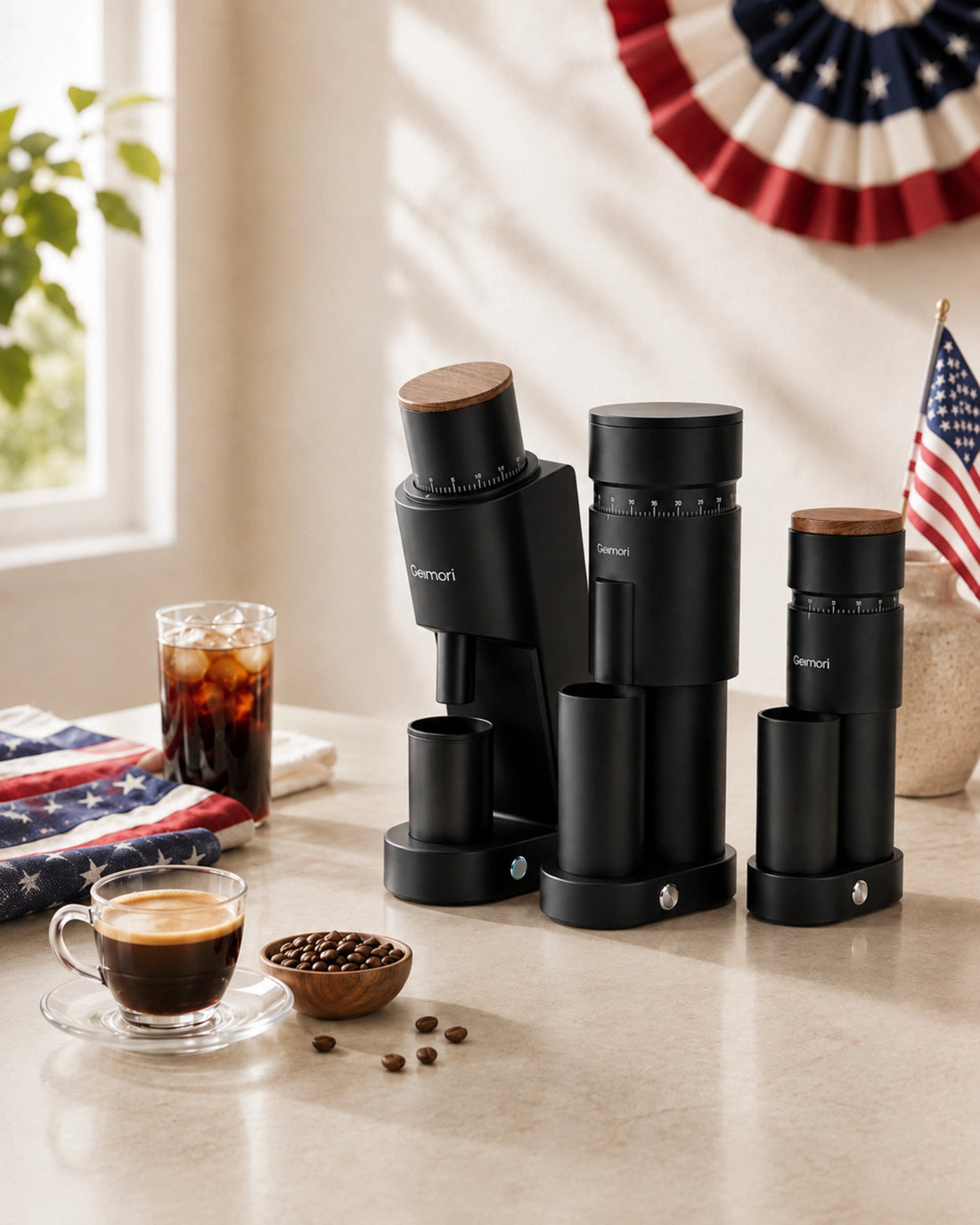 Geimori Coffee Grinders arranged on a light countertop in a bright kitchen setting, alongside coffee cups, beans, and patriotic decor.slider_item_3FJgtJ